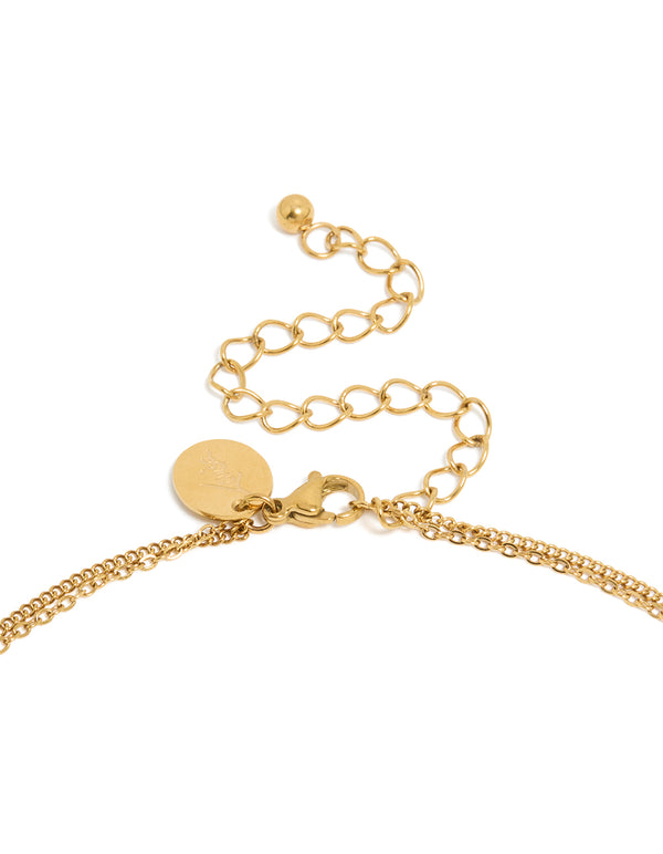 This waterproof layered necklace features hamsa hand and evil eye in gold plated stainless steel clasp detail view