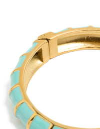 Highlighting this waterproof ribbed blue enamel bangle crafted from stainless steel with gold plating closure detail view - link has visual effect only