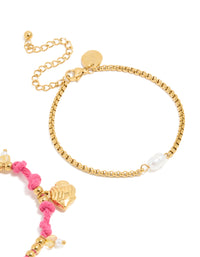 Highlighting waterproof gold plated stainless steel cord bracelets in a 2-pack with ocean charms, beads, rose quartz and freshwater pearl details in pink and white closure detail view - link has visual effect only