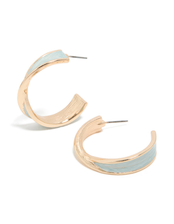 Showcasing twisted hoop earrings in gold featuring light blue enamel with marble pattern and statement styling front view