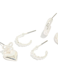 Discover chunky silver bow heart bubble stud and hoop earrings 3-pack close up view - link has visual effect only