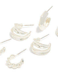 Featuring silver chubby and textured huggie earrings in a 3-pack close up view - link has visual effect only