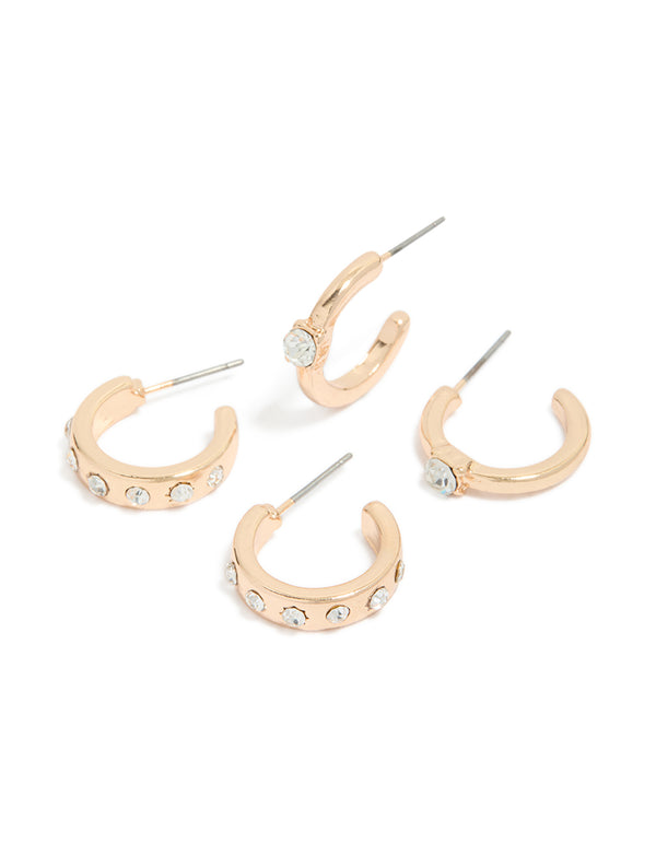Showcasing gold diamante hoop earrings in a 2-pack with clear stone embellishments front view
