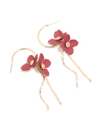 Showcasing statement drop earrings with floral accents in gold and red front view - link has visual effect only