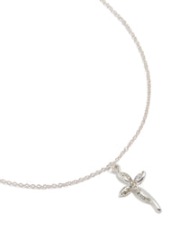 Showcasing a silver diamante twist cross pendant necklace with statement styling in close up view - link has visual effect only