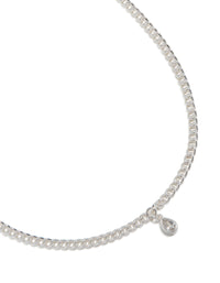 Showcasing a silver pear diamante drop Cuban link necklace with statement styling close up view - link has visual effect only
