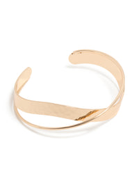 Showcasing a gold twisted wrist cuff front view - link has visual effect only