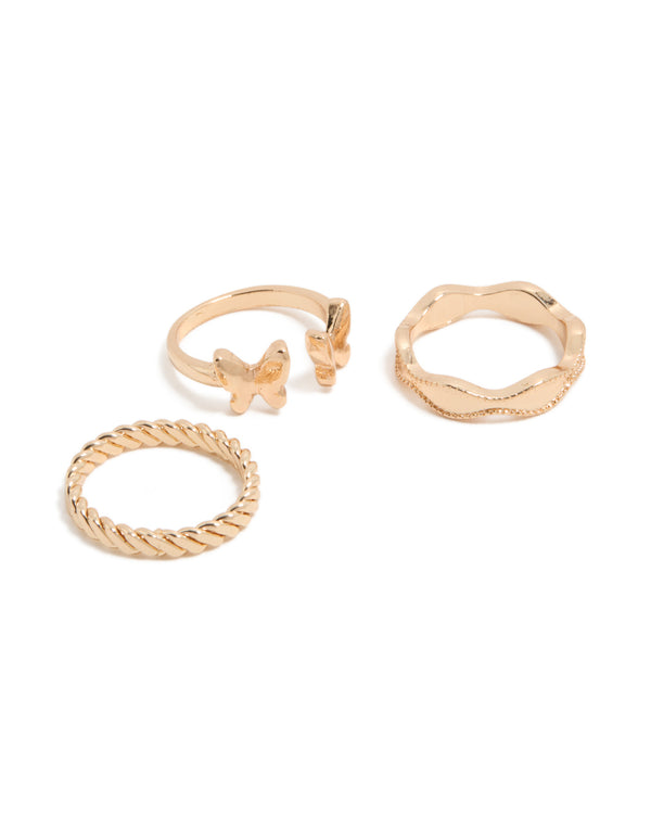Showcasing a gold butterfly and twisted rings 3-pack front view