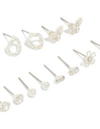 Featuring silver and diamante teardrop earrings 7-pack featuring butterfly, ball, and floral accents with clear stone details and stud closure close up view - link has visual effect only