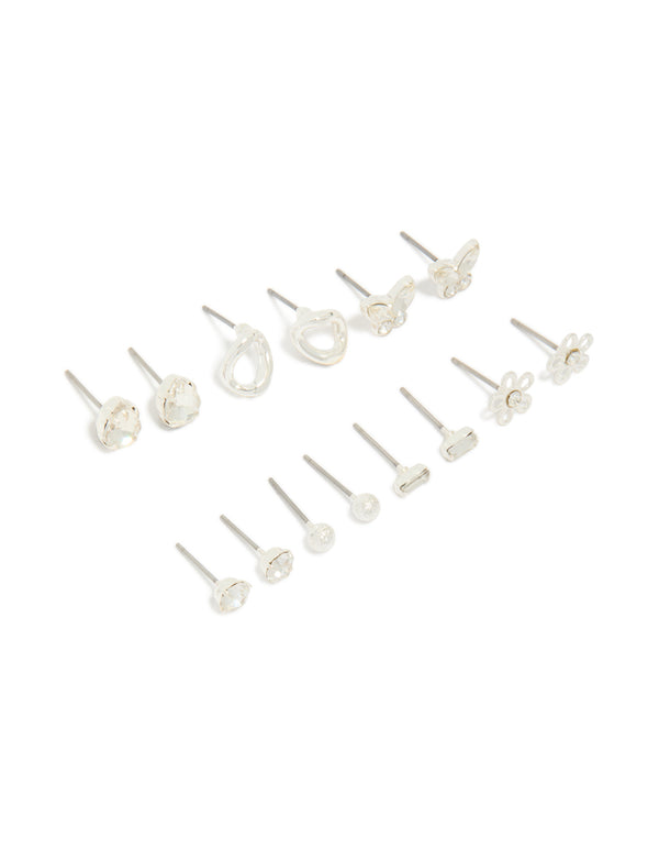 Showcasing a silver and diamante teardrop earrings 7-pack featuring butterfly, ball, and floral accents with clear stone details and stud closure front view