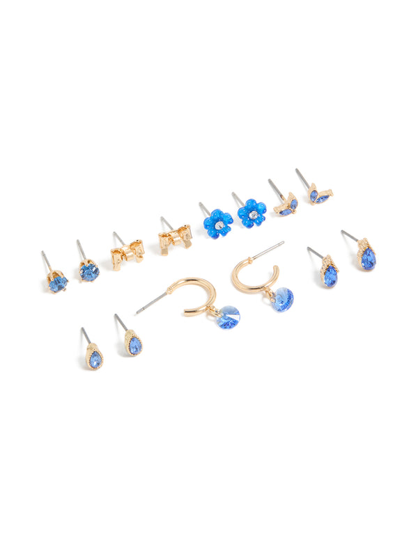 Showcasing a gold blue diamante earrings 7-pack featuring flower and bow designs with huggie and stud closures front view
