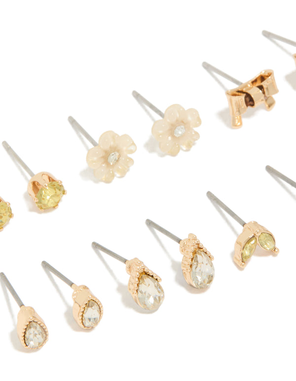 Featuring gold flower and bow earrings 7-pack in stud and hoop closures close up view