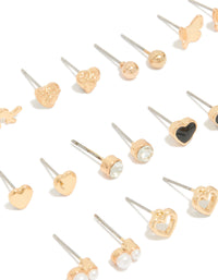 Explore this gold earrings 12-pack with pearl, butterfly, ball and heart stud closure in enamel close up view - link has visual effect only