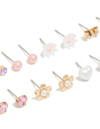 Crafted with gold diamante earrings 8-pack featuring butterfly, bow, floral, heart and pearl stud closure in pink white lavender close up view - link has visual effect only