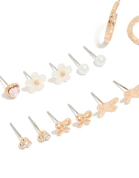 Crafted gold earrings 8-pack featuring bow, heart, pearl and butterfly details with stud and hoop closure in ivory, pink, and silver accents close up view - link has visual effect only