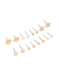 Showcasing stud earrings in an 8-pack featuring heart, pearl, and floral designs with gold finish front view - link has visual effect only