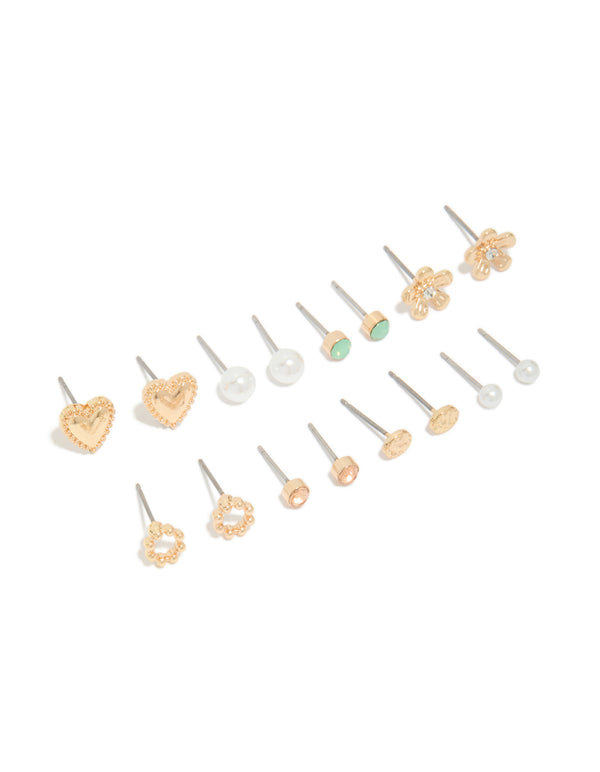 Showcasing stud earrings in an 8-pack featuring heart, pearl, and floral designs with gold finish front view