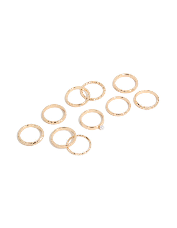 Discover a simple pearl and textured rings 10-pack in gold with stackable statement design front view