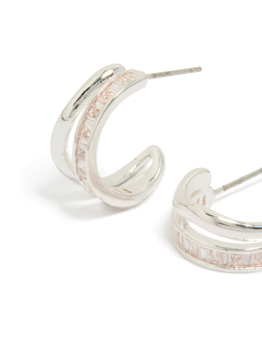 Crafted statement hoop earrings with silver plated material and cubic zirconia baguette cut stones close up view