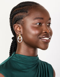 Featuring mixed metal plated double link illusion hoop earrings in gold and silver with statement style on model view - link has visual effect only