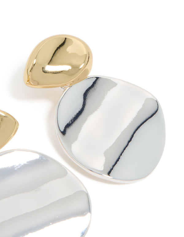 Showcasing mixed metal plated statement disc drop earrings in gold and silver post detail view