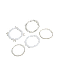 Showcase five kids stretch bracelets featuring beaded designs with bow charms and pearl accents in silver and white front view - link has visual effect only