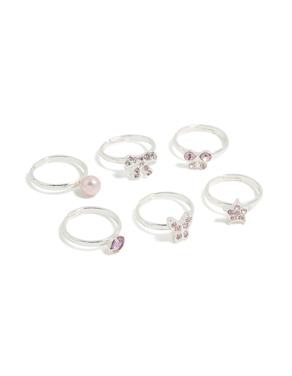Showcasing kids diamante rings featuring bow and butterfly, pearl and star in silver with pearl pink and plum accents front view