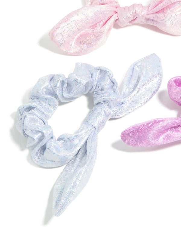 Featuring kids pastel polyester bunny ear scrunchies in a 3-pack with glitter and solid print in lavender, light blue, and light pink detail view