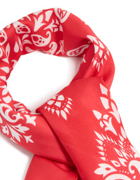 Beautifully crafted red paisley print fabric scarf in white detail view - link has visual effect only