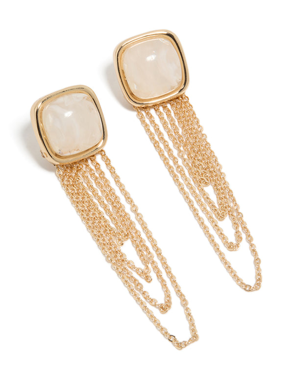 Displaying statement gold white stone and layered chain drop earrings front view