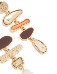 Crafted with statement mismatched design featuring charm ocean pearl and shell elements in gold post detail view - link has visual effect only