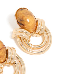 Detailed view of gold brown stone and double lined stud earrings finish - link has visual effect only