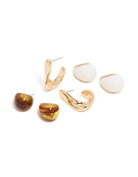 Showcasing gold brown acrylic and white stud earrings in a 3 pack front view - link has visual effect only