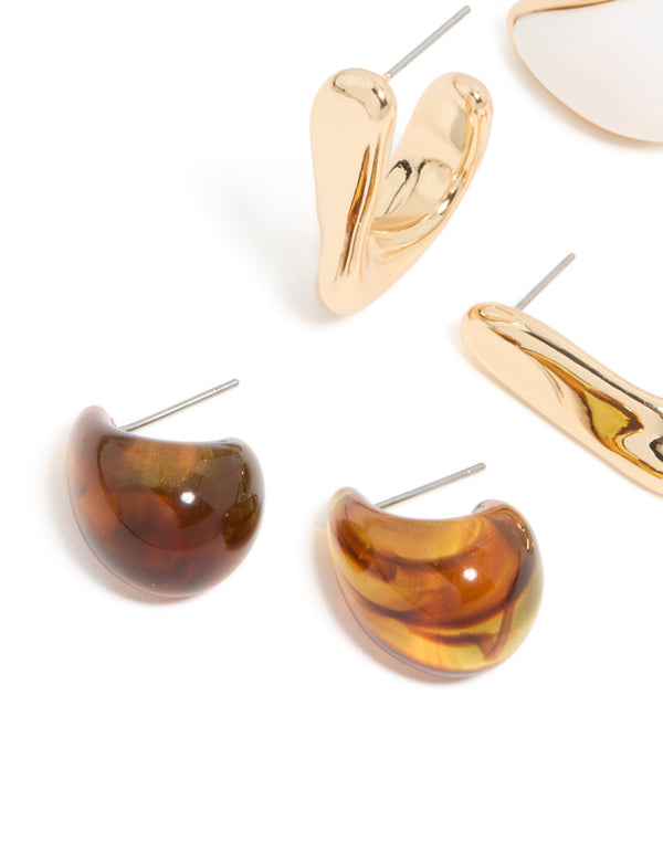 Featuring gold brown and white acrylic stud earrings in a 3 pack close up view