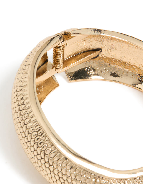 Featuring a gold dotted boho hinged statement bangle closure detail view