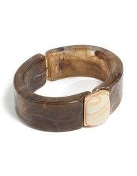 Showcasing a chunky brown and white acrylic square wrist cuff in tan, beige, and gold front view - link has visual effect only
