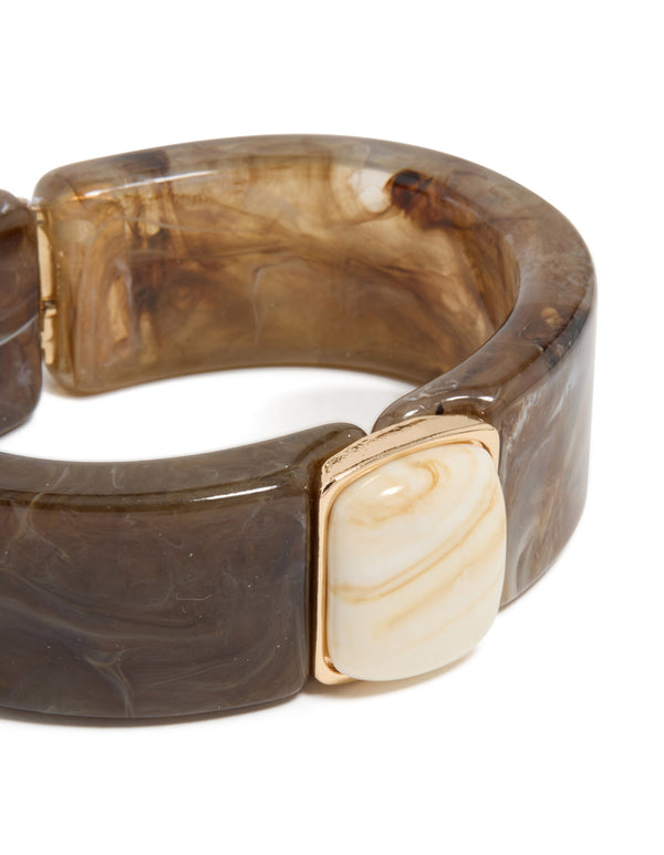 Discover the marbled texture of this chunky brown and white acrylic square wrist cuff in tan, beige, and gold close up view