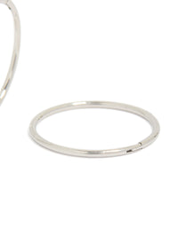 Detailing surgical steel sleeper earrings in silver with hoop closure post detail view - link has visual effect only