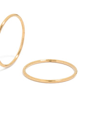 Highlighting 12 MM sleeper hoop earrings crafted from gold plated surgical steel in close up view - link has visual effect only