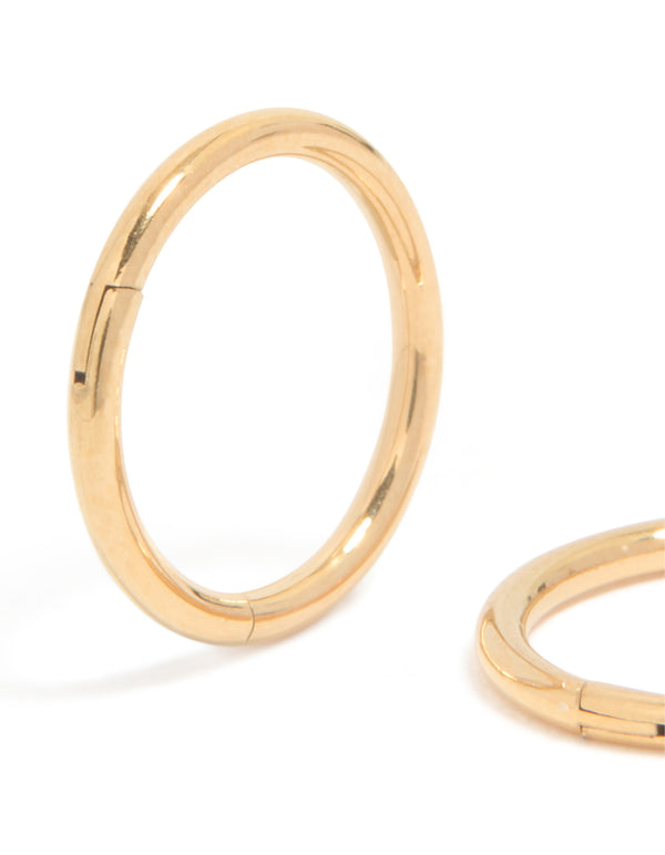 Featuring gold plated surgical steel 8 MM thick sleeper earrings with hoop closure close up view
