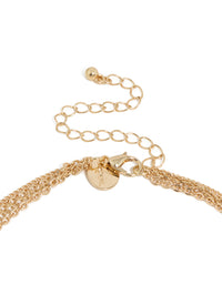 Beautiful statement necklace with beads, tassel, charm and disc in gold clasp detail view - link has visual effect only