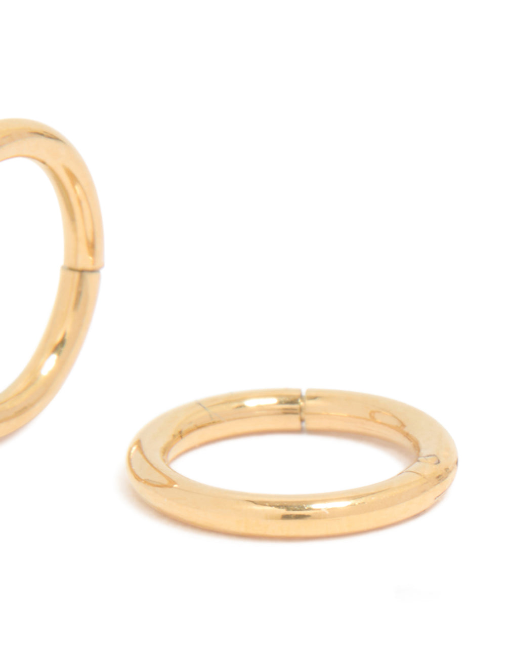 Featuring gold plated titanium 6MM thick sleeper earrings with hoop closure and chunky design post detail view