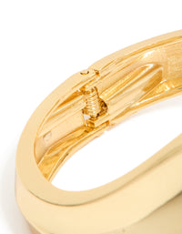 Highlighting gold plated thick curved statement bangle closure detail view - link has visual effect only
