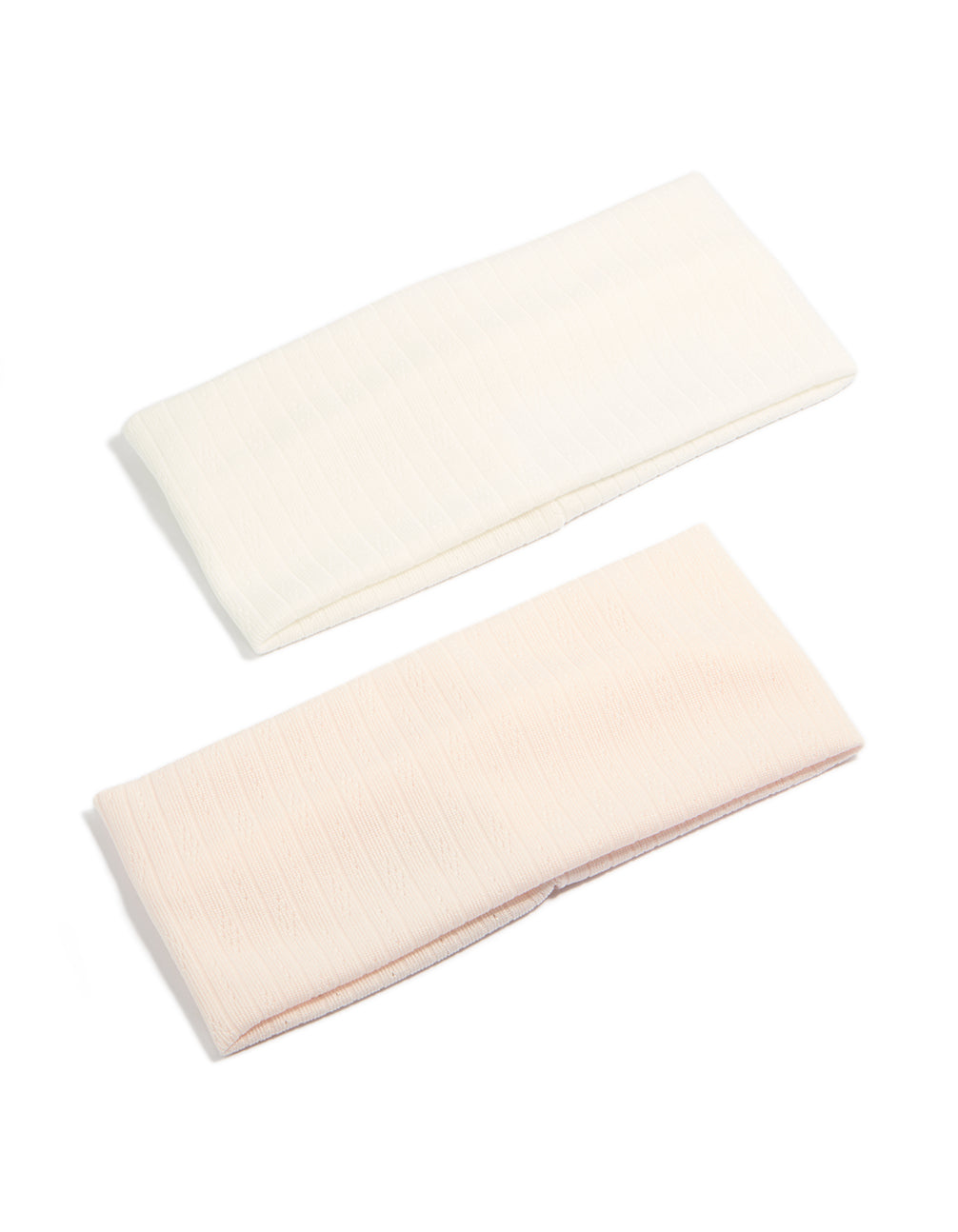 Discover solid 2-pack ivory and pink stretch headbands front view