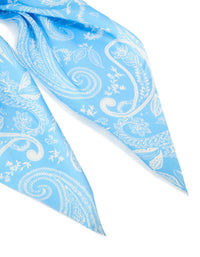 Crafted from light blue fabric, this paisley scarf scrunchie features leaf designs in white detail view - link has visual effect only