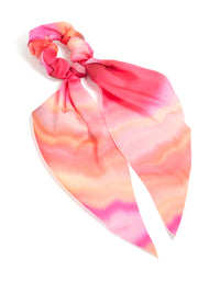 Discover this statement scarf scrunchie featuring tie-dye print in hot pink, coral, and peachpuff tones with long strap front view - link has visual effect only