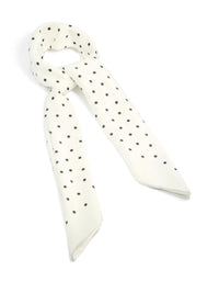 Showcasing a polkadot fabric scarf in white and black front view - link has visual effect only