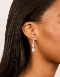 Discover silver plated double teardrop hook earrings with clear cubic zirconia on ear view - link has visual effect only