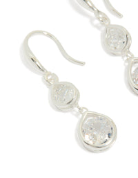 Highlighting silver plated double teardrop hook earrings with clear cubic zirconia close up view - link has visual effect only