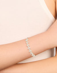 Crafted from silver plated cubic zirconia, this vine leaf toggle bracelet features a statement style on wrist view - link has visual effect only